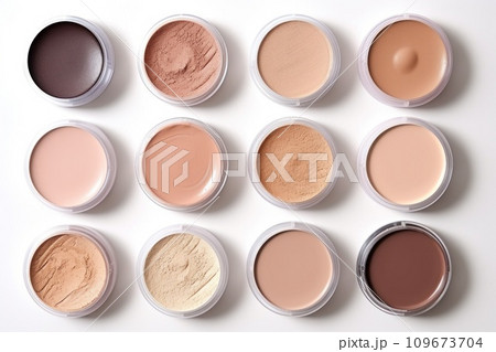 Skin correction makeup products in pots isolated on white background. Foundation, concealer, powder arrange in jars. Samples of eyeshadow, face powder. Beauty, fashion concept. 109673704