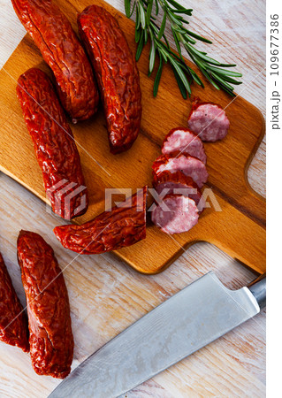 Smoked sausages with spices 109677386