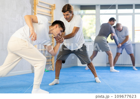 Two men training judo technique in studio 109677623