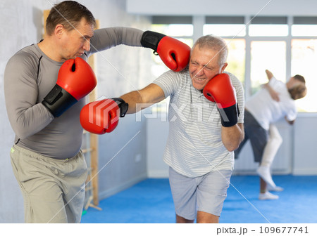 Two men training boxing fight in studio 109677741