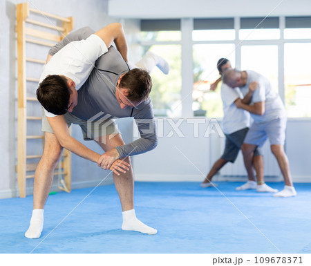 Two men training judo technique in studio 109678371