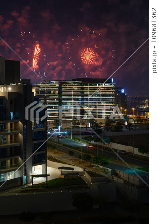 Al Raha Beach at Night with Fireworks Display over Yas Island in Abu Dhabi Al Raha Beach at Night with Fireworks Display over Yas Island in Abu Dhabi 109681362