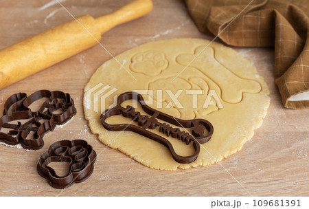 Preparing homemade healthy dog treats. Preparing homemade healthy dog treats. 109681391