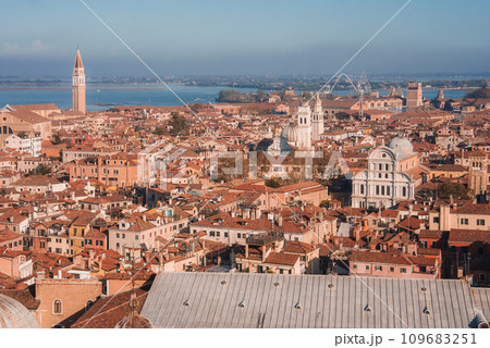 Aerial view of Venice, Italy with no specific landmarks or architectural styles visible. Predominant color scheme and time of day unspecified. Overall cityscape view. Aerial view of Venice, Italy with no specific landmarks or architectural styles visible. Predominant color scheme and time of day unspecified. Overall cityscape view. 109683251