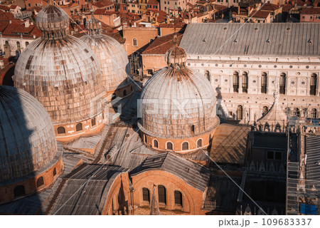 Aerial view of gray domes in Venice, providing a distinctive visual of the city's architecture. Unknown architectural style and details. Aerial view of gray domes in Venice, providing a distinctive visual of the city's architecture. Unknown architectural style and details. 109683337