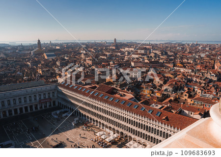 Breathtaking cityscape view of Venice, Italy with iconic buildings and winding canals. Classic Venetian architecture, warm sunlight, and bustling canals capture the timeless beauty of the city. Breathtaking cityscape view of Venice, Italy with iconic buildings and winding canals. Classic Venetian architecture, warm sunlight, and bustling canals capture the timeless beauty of the city. 109683693