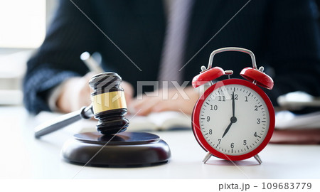 The judge hammer lies on table in 109683779
