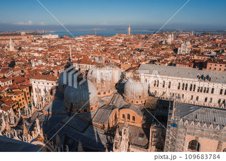 Aerial view of Venice, Italy showcasing iconic canals, historic buildings, and gondolas. The city's unique layout, classic Venetian architecture, and romantic atmosphere 109683784