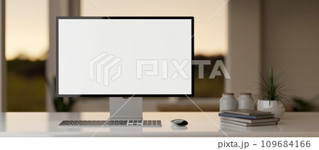 Front view of a modern workspace in a modern office room with a PC desktop computer mockup on a desk 109684166