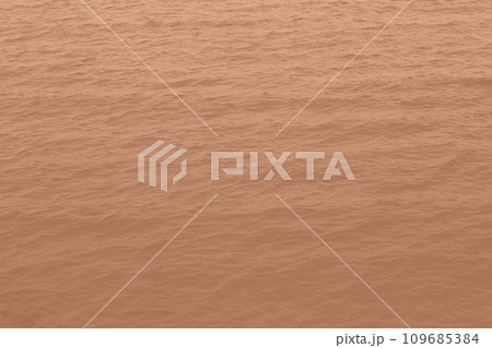 Peach Fuzz toned sea water texture. Pool water with sun reflections. Trendy colour 2024 year. 109685384