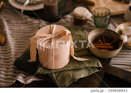 Gift box is on the dining table on a napkin 109686641