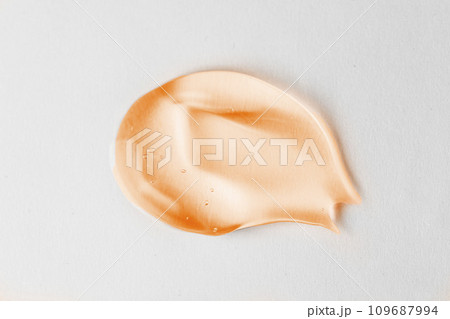 Swatches from various cosmetic products, drops of lotion, smears of creams, gels and scrubs on blue background Swatches from various cosmetic products, drops of lotion, smears of creams, gels and scrubs on blue background 109687994