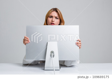 young woman sitting in the table and using computer young woman sitting in the table and using computer 109689175