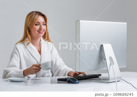 young woman sitting in the table and using computer young woman sitting in the table and using computer 109689245