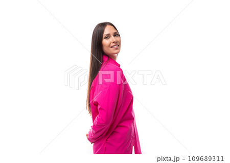 stylish caucasian woman with black straight hair is dressed in a crimson shirt on a white background stylish caucasian woman with black straight hair is dressed in a crimson shirt on a white background 109689311