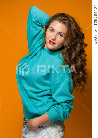 Portrait gloomy young brunette woman with wavy hair 109689407
