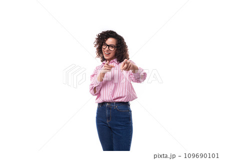 young pretty lady with curly black hair in a pink blouse and jeans on a white background with copy young pretty lady with curly black hair in a pink blouse and jeans on a white background with copy 109690101