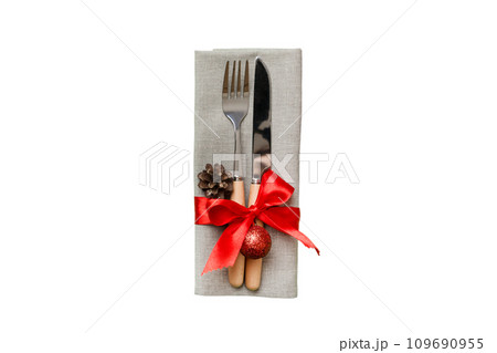 isolated christmas Plate with decor and fork and spoon. New year holiday background. Top view 109690955