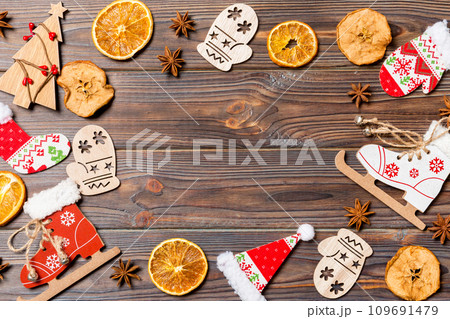 Top view of Christmas decorations and toys on wooden background. Copy space. Empty place for your design. New Year concept 109691479