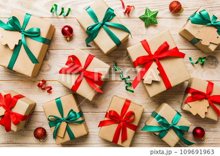 Colored craft gift boxes with colorful ribbons on colored background. Collection of Christmas present boxes 109691963