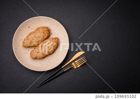 Delicious fresh fried minced fish or chicken cutlets with spices and herbs Delicious fresh fried minced fish or chicken cutlets with spices and herbs 109693102