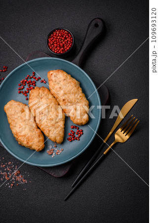 Delicious fresh fried minced fish or chicken cutlets with spices and herbs 109693120