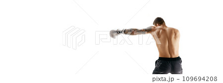 Back view of shirtless, muscular young man, boxer in motion, training, punching isolated over white background 109694208