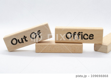 Out of office text on wooden blocks with white background. Out of office concept Out of office text on wooden blocks with white background. Out of office concept 109698868