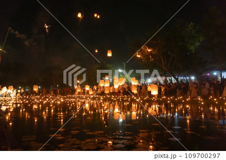 Thai people release sky floating lanterns or lamp to worship Buddha's relics at night. Traditional festival in Chiang mai, Thailand. Loy krathong Thai people release sky floating lanterns or lamp to worship Buddha's relics at night. Traditional festival in Chiang mai, Thailand. Loy krathong 109700297