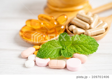 Alternative medicine herbal organic capsule with vitamin E omega 3 fish oil, mineral, drug with herbs leaf natural supplements for healthy good life. Alternative medicine herbal organic capsule with vitamin E omega 3 fish oil, mineral, drug with herbs leaf natural supplements for healthy good life. 109701406