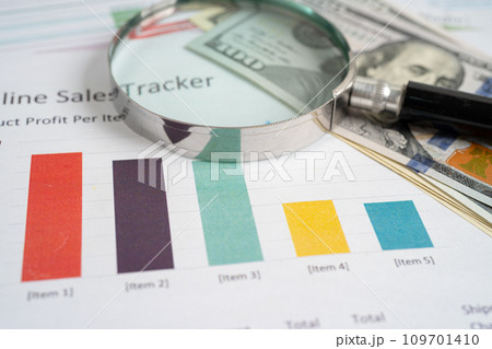 Magnifying glass on graph paper. Financial development, Banking Account, Statistics, Investment Analytic research data economy, Business concept. 109701410
