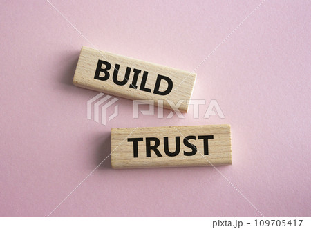 Build trust symbol. Wooden blocks with words Build trust. Beautiful pink background. Business and Build trust concept. Copy space. Build trust symbol. Wooden blocks with words Build trust. Beautiful pink background. Business and Build trust concept. Copy space. 109705417