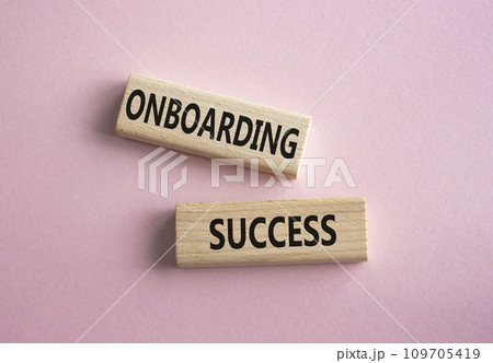 Onboarding Success symbol. Concept word Onboarding Success on wooden blocks. Beautiful pink background. Business and Onboarding Success concept. Copy space 109705419