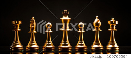 gold chess pieces on a dark background gold chess pieces on a dark background 109706594