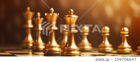 golden chess pieces on a table golden chess pieces on a table 109706647