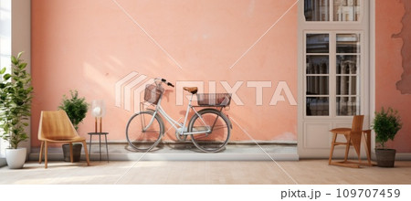 old wooden bicycles by the door of a pink wall old wooden bicycles by the door of a pink wall 109707459