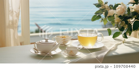 a glass of tea with breakfast on the table a glass of tea with breakfast on the table 109708440