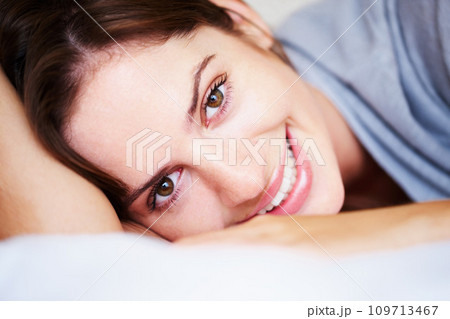 Relax, smile and portrait of woman on bed for sleeping, dreaming and comfortable at home. Happy, cozy and face of person in bedroom resting, nap and wake up for health, wellness and calm in morning Relax, smile and portrait of woman on bed for sleeping, dreaming and comfortable at home. Happy, cozy and face of person in bedroom resting, nap and wake up for health, wellness and calm in morning 109713467