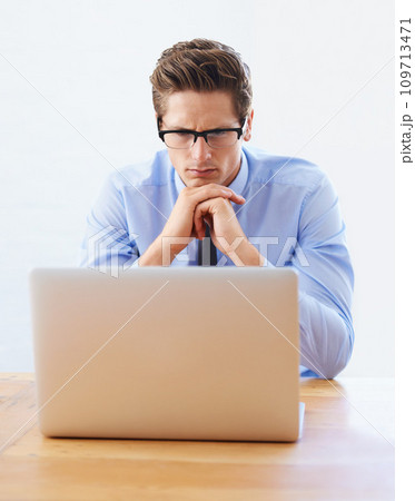 Business man, confused and thinking on computer for research, online planning and investment decision. Professional analyst or trader in reading glasses, problem solving or trading solution on laptop Business man, confused and thinking on computer for research, online planning and investment decision. Professional analyst or trader in reading glasses, problem solving or trading solution on laptop 109713471
