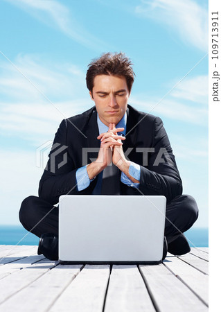 Laptop, thinking and business man by blue sky for working online, reading website and planning. Corporate, remote work and worker on computer brainstorming ideas for project, networking and research 109713911