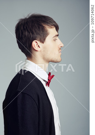 Profile, business and fashion with man, thinking and confident guy on grey studio background. Person, entrepreneur or model with stylish outfit, elegant clothes or worker with professional or bow tie Profile, business and fashion with man, thinking and confident guy on grey studio background. Person, entrepreneur or model with stylish outfit, elegant clothes or worker with professional or bow tie 109714062