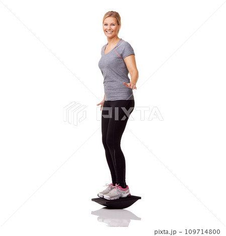 Exercise, studio portrait and woman with board balance, smile and healthy body workout at gym. Fitness, stability and happy girl with wellness, pilates training and tools isolated on white background 109714800