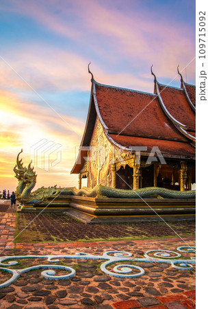 Wat Sirindhorn Wararam glowing temple in Ubon, Thailand 109715092