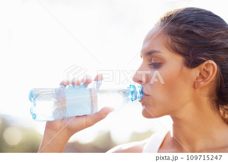 Drinking water, fitness and woman outdoor for running, wellness or training on white background. Sports, liquid and face profile of female runner outside for exercise, workout or morning cardio run 109715247