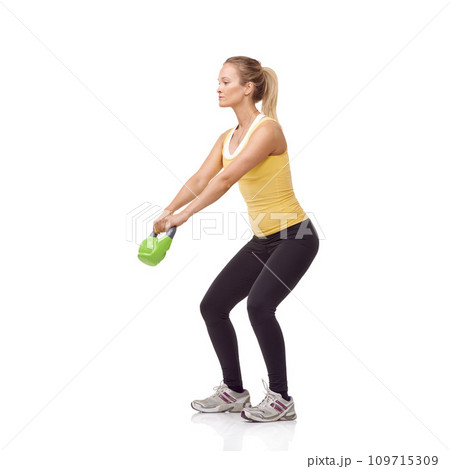 Training, strong and studio woman with kettlebell for arm muscle growth, strength power development or weightlifting. Sports club equipment, active workout and female bodybuilder on white background Training, strong and studio woman with kettlebell for arm muscle growth, strength power development or weightlifting. Sports club equipment, active workout and female bodybuilder on white background 109715309