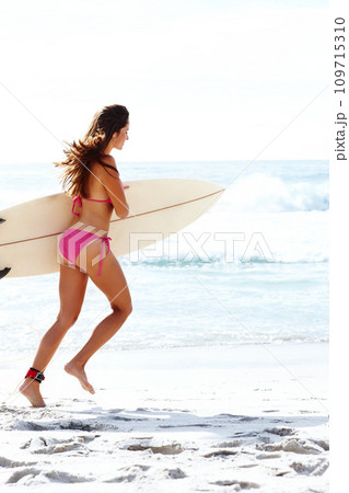 Running, surfboard and woman in bikini at ocean for summer vacation, travel adventure or tropical island. Relax, surfing and girl on blue sky at beach for holiday with waves, sun and sport in Hawaii. Running, surfboard and woman in bikini at ocean for summer vacation, travel adventure or tropical island. Relax, surfing and girl on blue sky at beach for holiday with waves, sun and sport in Hawaii. 109715310