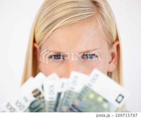 Eyes, finance and woman serious about money in studio on a white background for tax, salary or increase. Accounting, economy or payment and a young person with cash for bank savings or growth Eyes, finance and woman serious about money in studio on a white background for tax, salary or increase. Accounting, economy or payment and a young person with cash for bank savings or growth 109715787