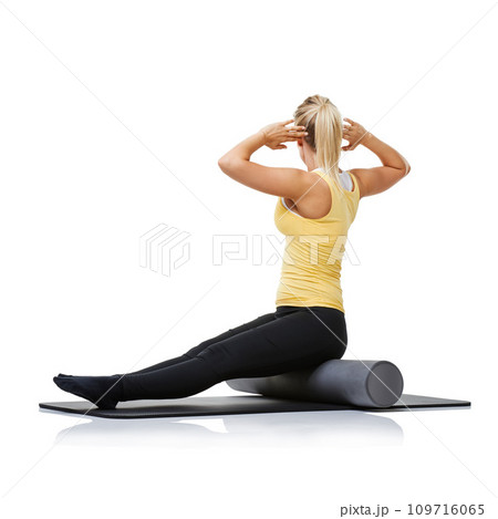 Yoga fitness, foam roller and person stretching back for spine posture training, wellness challenge or active performance. Studio floor, exercise mat and athlete physical activity on white background Yoga fitness, foam roller and person stretching back for spine posture training, wellness challenge or active performance. Studio floor, exercise mat and athlete physical activity on white background 109716065