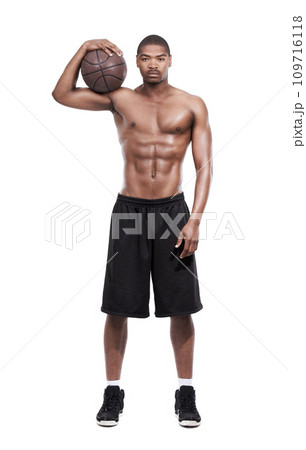 Fitness, power and portrait of black man with basketball, six pack and shirtless body muscle workout challenge. Sports wellness, health and professional athlete with ball isolated on white background 109716118