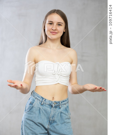 Young smiling woman posing in studio Young smiling woman posing in studio 109716414